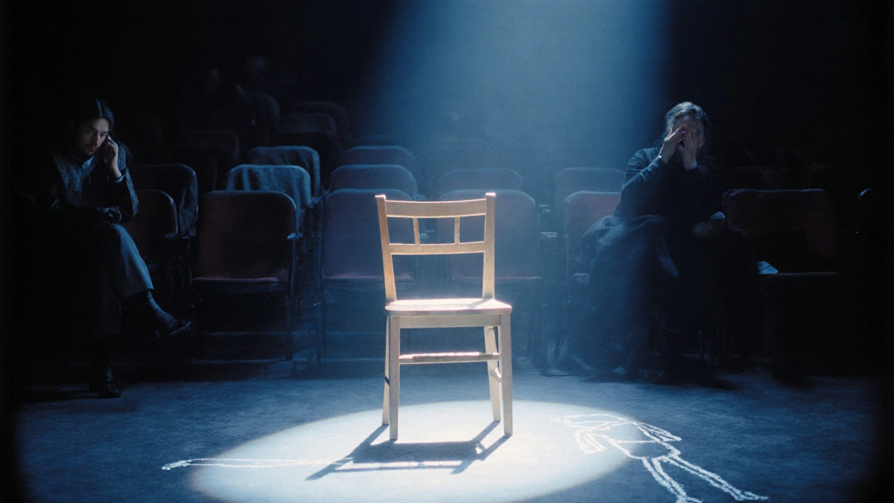 A single chair under a beam of light after a silent mime show, one audience member crying in darkness.