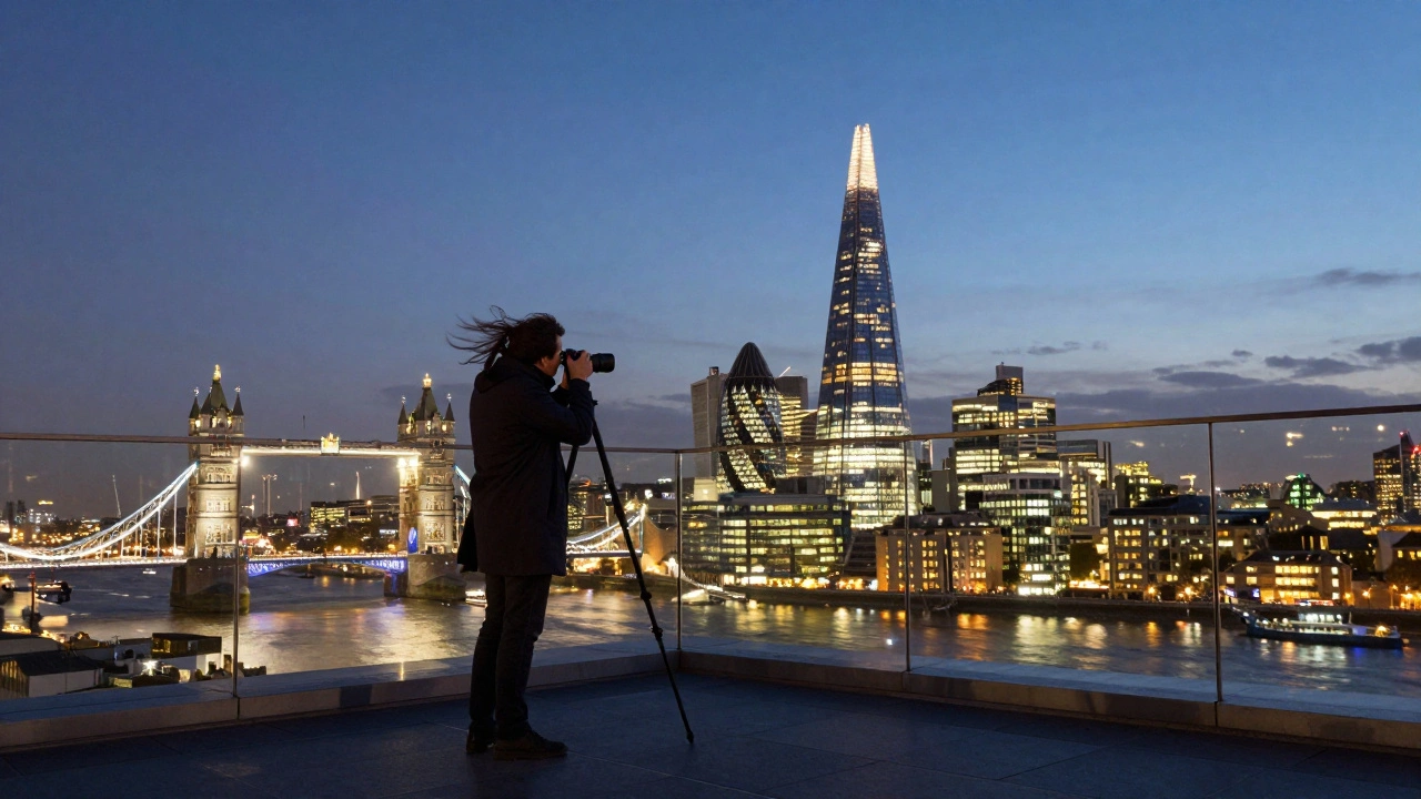 Photographer on The Shard’s open terrace at dusk with London’s illuminated skyline below.