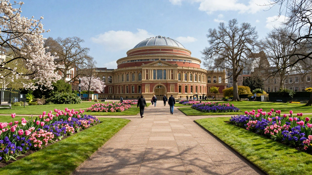 A scenic view of Kensington Gardens with blooming flowers and the Royal Albert Hall in the distance.